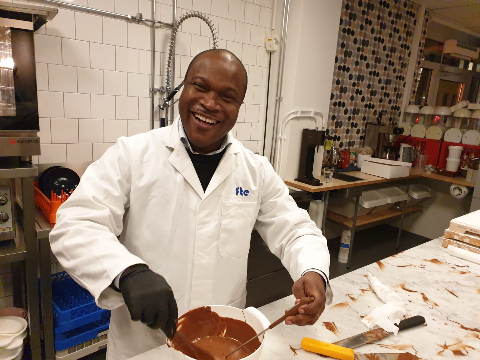 Roger Aidoo with full enthusiasm in the chocolate kitchen